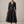 Eloise wrap midi dress in Black on a light gray studio backdrop