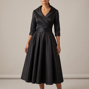Eloise wrap midi dress in Black on a light gray studio backdrop