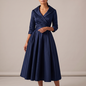 Eloise wrap midi dress in Navy Blue on a light gray studio backdrop