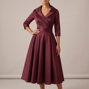 Eloise wrap midi dress in Wine on a light gray studio backdrop