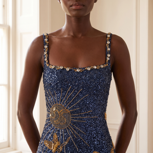 Close view of the Elsie jeweled square neckline and gold beaded sunburst