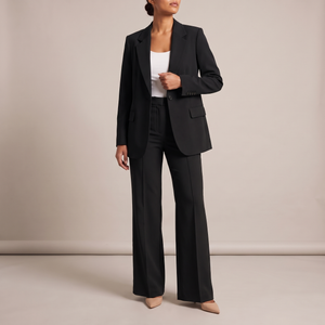 Eudora blazer and wide leg pants set in Black on a light gray studio backdrop