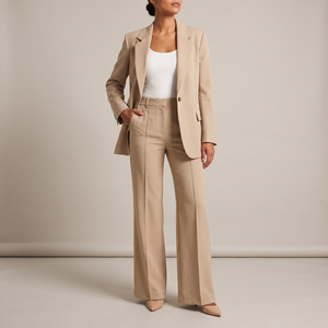 Eudora blazer and wide leg pants set in Beige on a light gray studio backdrop