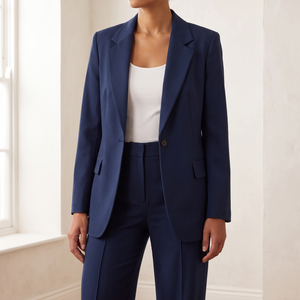 Close view of the Eudora blazer in Navy Blue showing the notched lapels, single button and flap pockets