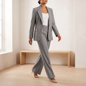 Eudora blazer and wide leg pants set in Gray, model walking across a pale oak floor