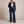 Eudora blazer and wide leg pants set in Navy Blue on a light gray studio backdrop