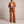 Eudora blazer and wide leg pants set in Rust on a light gray studio backdrop