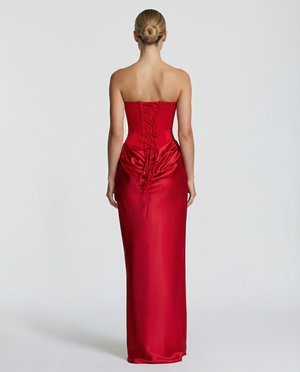 Faustine strapless maxi dress in Red from the back, showing the lace up corset