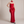 Faustine strapless maxi dress in Red with a sheer scarf on a light gray studio backdrop