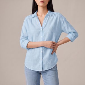 Francesca linen blend button down shirt in Blue on a light gray studio backdrop