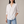 Francesca linen blend button down shirt in White on a light gray studio backdrop