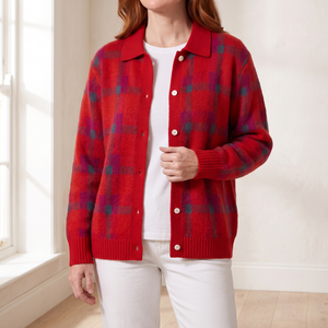 Francine plaid button front cardigan in Red, worn open over a white tee by a window