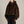 Georgina faux fur hoodie in Brown on a light gray studio backdrop