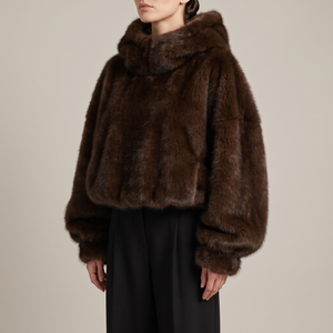 Georgina faux fur hoodie in Brown on a light gray studio backdrop