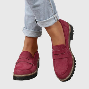 Gloria suede penny loafers in Raspberry worn with cuffed jeans