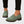 Gloria suede penny loafers in Sage worn with black cropped trousers