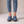 Gloria suede penny loafers in Blue seen from the front on a light gray studio backdrop