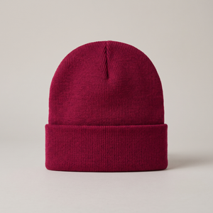 Hattie knit beanie in Burgundy with a folded cuff on a light gray studio backdrop