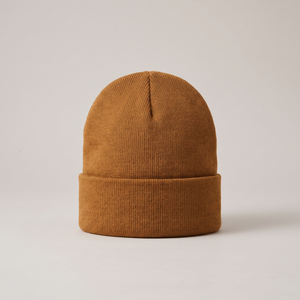 Hattie knit beanie in Camel with a folded cuff on a light gray studio backdrop