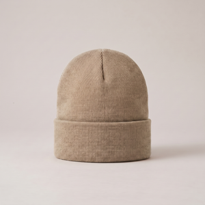 Hattie knit beanie in Khaki with a folded cuff on a light gray studio backdrop