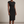 Hester ruched sheath dress in Black on a light gray studio backdrop
