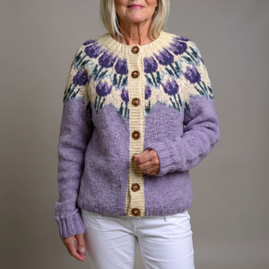 Honorine floral yoke cardigan in Lavender, buttoned, on a light gray studio backdrop