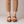 Hortense leather Mary Jane pumps in Cognac on a light gray studio backdrop