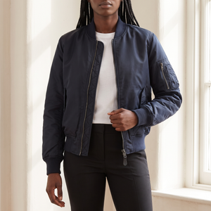 Imelda nylon bomber jacket in Navy Blue showing the ribbed collar, front zip and sleeve pocket