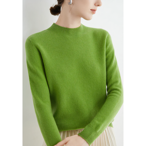 Imogen cashmere mock neck sweater in Light Green on a model