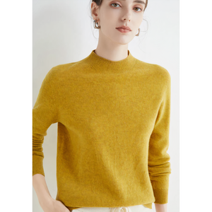 Imogen cashmere mock neck sweater in Mustard on a model