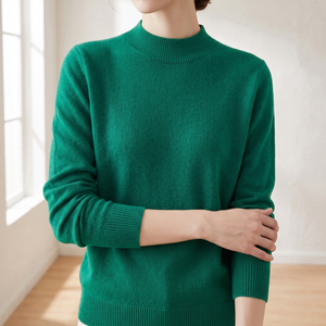 Close view of the Imogen sweater mock neck, fine knit and ribbed cuff in Green
