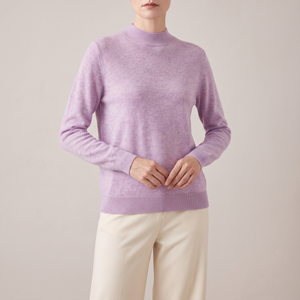 Imogen cashmere mock neck sweater in Lavender worn with cream wide leg trousers
