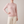 Imogen cashmere mock neck sweater in Pink worn with cream wide leg trousers
