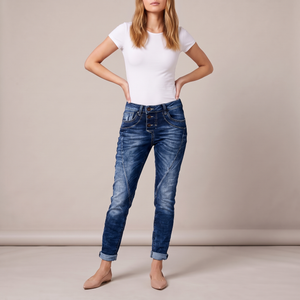 Irene skinny jeans in Dark Blue on a light gray studio backdrop