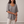 Jemima loose scoop neck blouse in Gray on a light gray studio backdrop