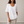 Jemima loose scoop neck blouse in White on a light gray studio backdrop