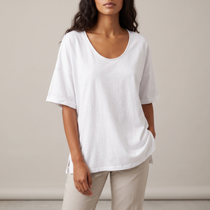 Jemima loose scoop neck blouse in White on a light gray studio backdrop
