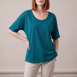 Jemima loose scoop neck blouse in Teal on a light gray studio backdrop