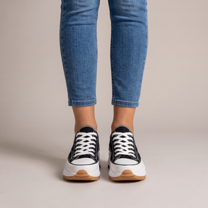 Laetitia canvas platform sneakers in Black seen from the front on a light gray studio backdrop