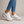 Laetitia canvas platform sneakers in White on a light gray studio backdrop