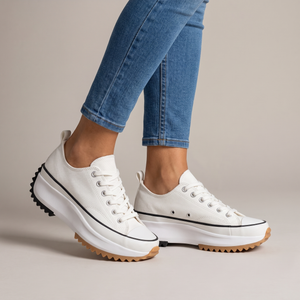 Laetitia canvas platform sneakers in White on a light gray studio backdrop