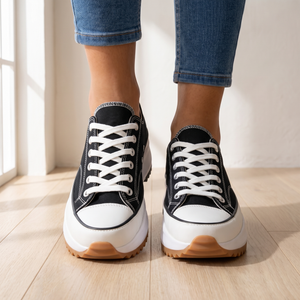 Close front view of the laces and toe caps on the Laetitia canvas platform sneakers in Black
