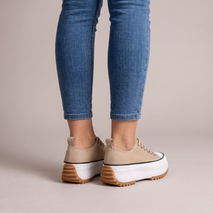 Laetitia canvas platform sneakers in Tan seen from behind on a light gray studio backdrop
