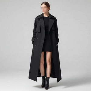 Lillian long trench coat in Black worn open over a black dress