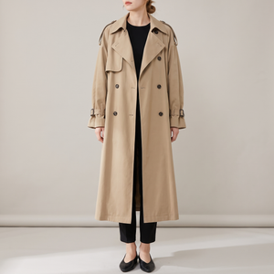 Lillian long trench coat in Khaki on a light gray studio backdrop
