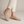Lorelei slip on flats in Beige on a light gray studio backdrop