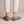 Lorelei slip on flats in Khaki seen from behind on a light gray studio backdrop