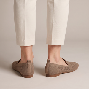 Lorelei slip on flats in Khaki seen from behind on a light gray studio backdrop