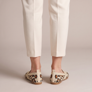 Lorelei slip on flats in Leopard Print seen from behind on a light gray studio backdrop