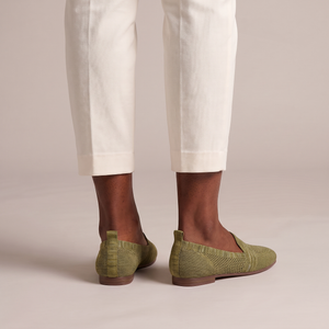 Lorelei slip on flats in Olive seen from behind on a light gray studio backdrop